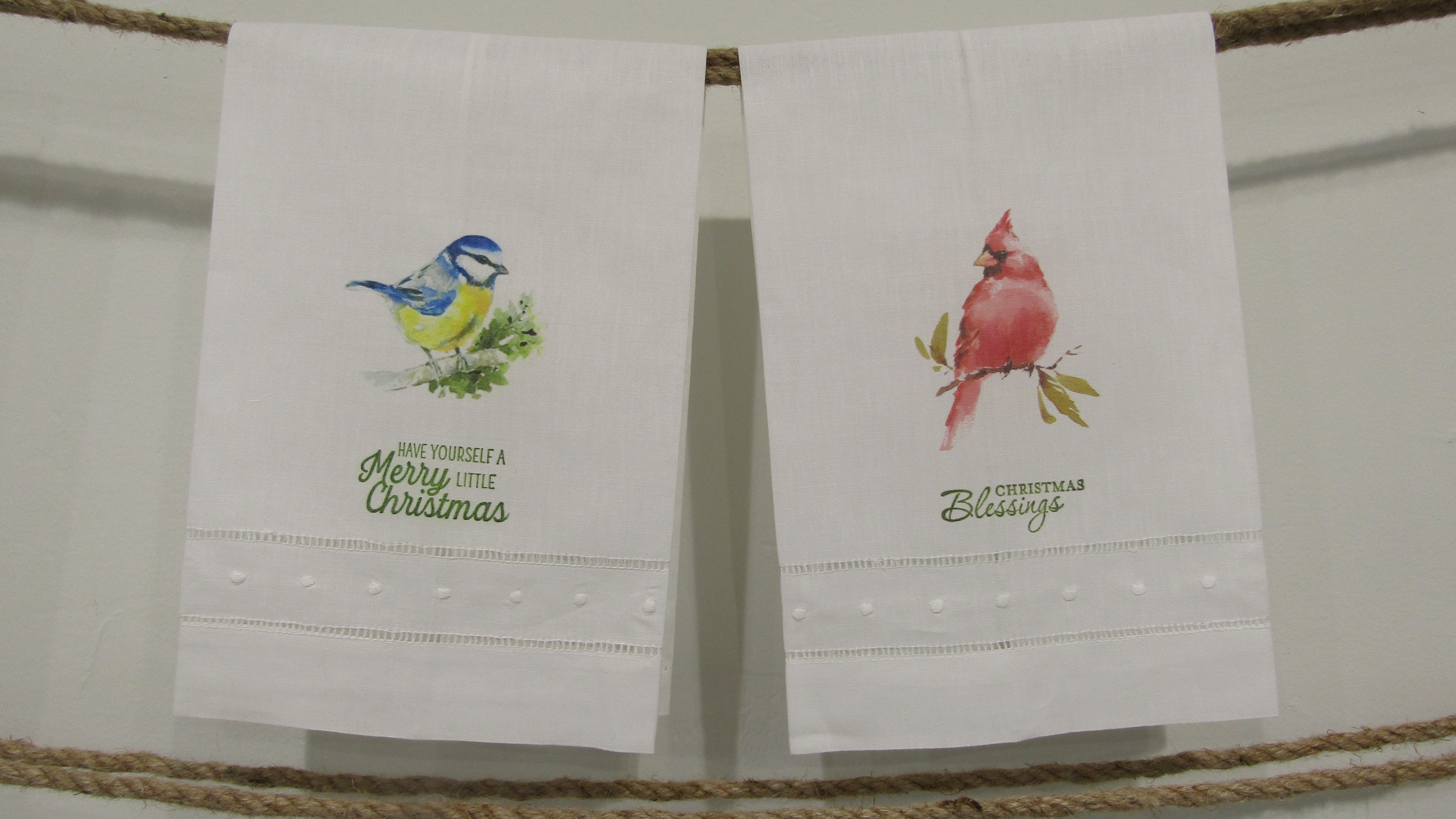 Locally printed kitchen towels with a little blue bird and red cardinal