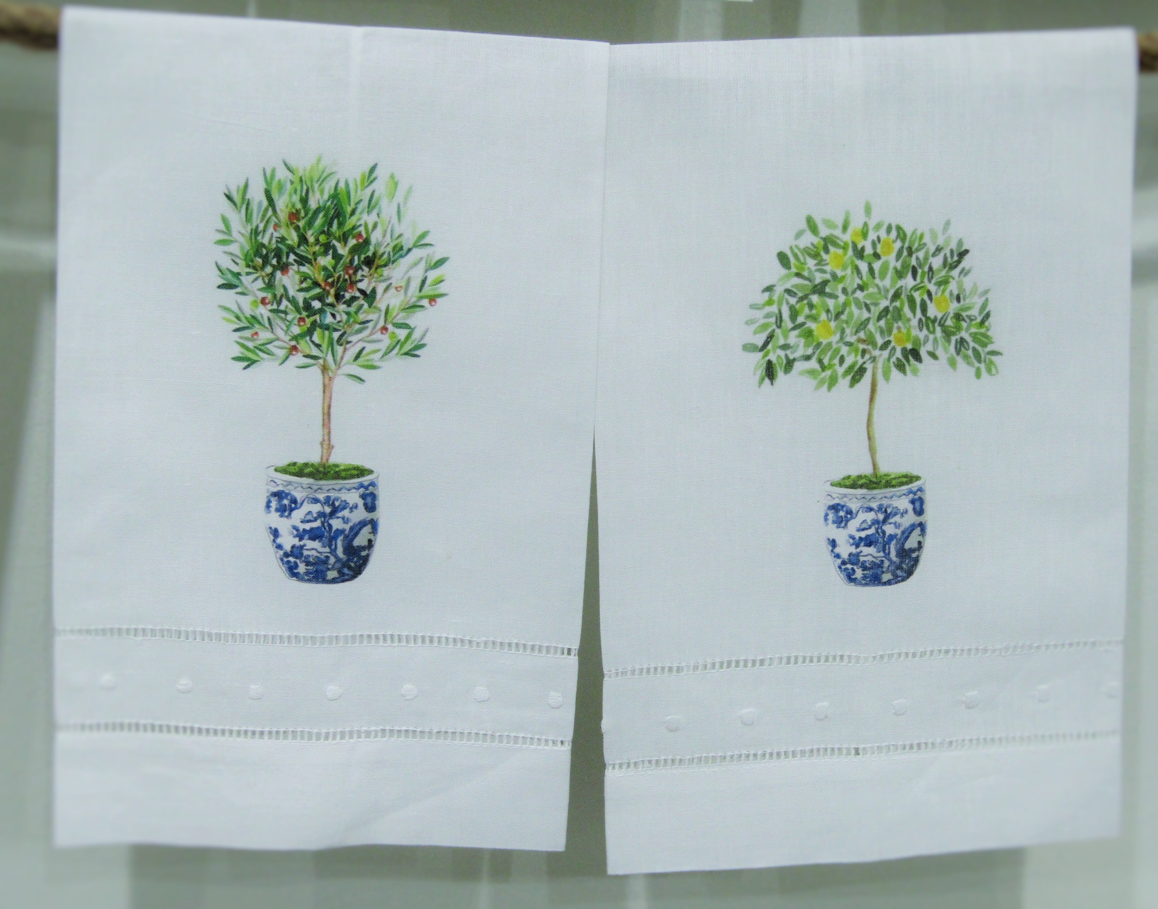 Locally printed kitchen towels with topiary plants in blue and white pots